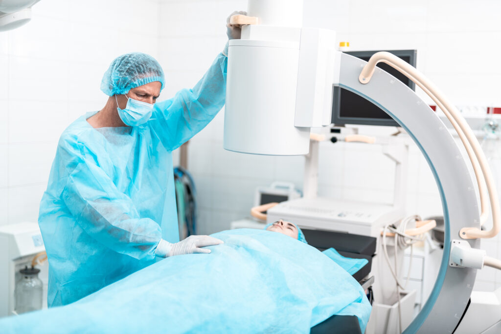 Waist,Up,Of,Experienced,Doctor,Wearing,Blue,Medical,Clothes,And What is a C-Arm?